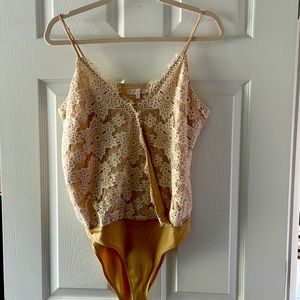 Lace body, size M. Only worn couple times, very cute with jackets